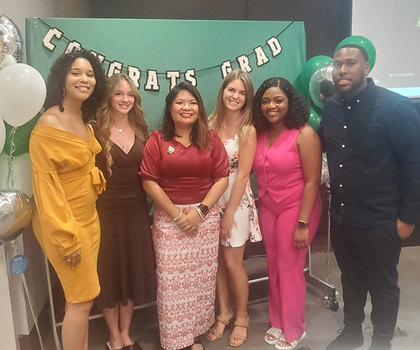 Decker's Division of Public Health celebrated students graduating from its Master of Public Health (MPH) program, including outgoing MPH Graduate Student Organization officers (left to right) Franchesca Marte Gonzalez, Elisabeth Van Tassell, Haythi Ei, Megan Sticco, Lutricia Colin and Malik Kerr.
