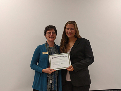 Biomedical engineering student Margaret Blystone with Associate Professor Aaron Beedle from the Department of Pharmaceutical Sciences commemorating the completion of the REU.