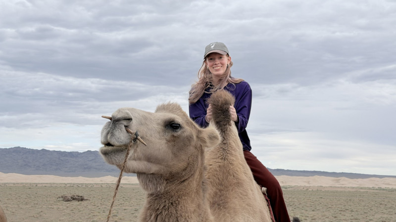 Sophomore Matilda Fillion rides a camel in the Gobi Desert.