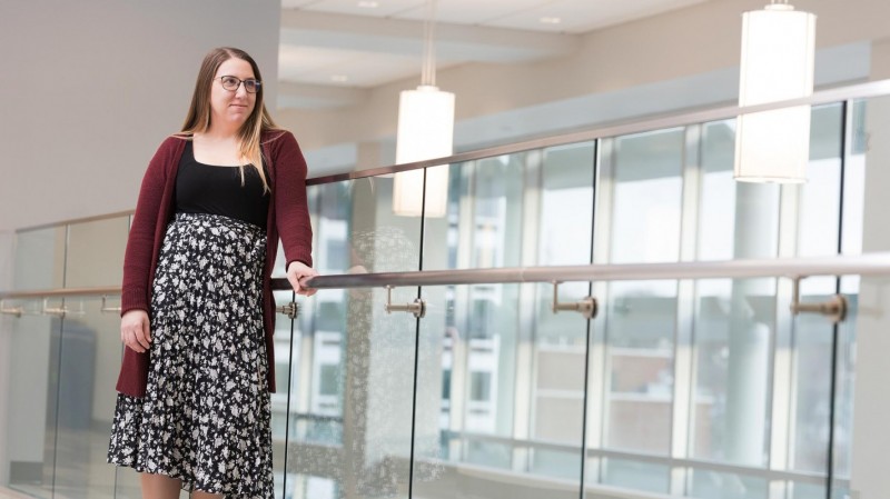 Clinical Assistant Professor Mia Lussier in the atrium of the Binghamton University School of Pharmacy and Pharmaceutical Sciences.