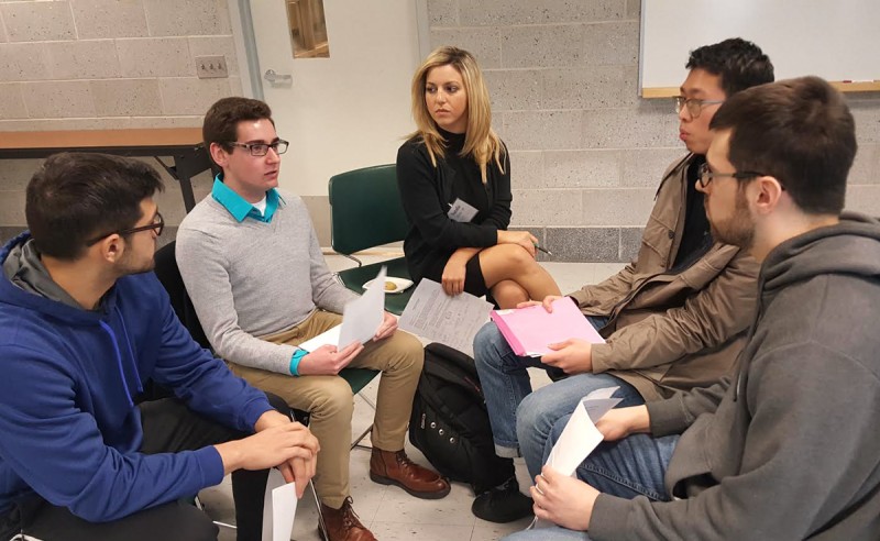 Pictured: Natalie Elisha ’09 observes students during workshop.