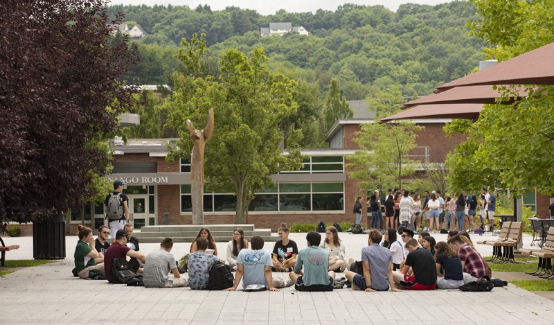 Incoming Harpur College freshmen participate in small-group meetings on campus during the first day of a July orientation session.