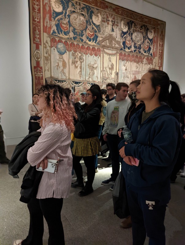Students gaze upon tapestries on display at the Metropolitan Museum of Art in New York City during the Center for Medieval and Renaissance Studies field trip on Oct. 14, 2022.