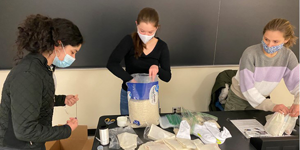 Members of the Public Service knowledge community pack care kits to be given to children at the Children's Home of Wyoming Conference to help them relieve stress during the pandemic.