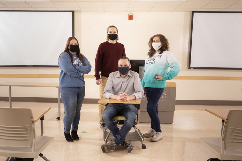 Graduate students Jason Bond, left, Aubrey Baranowski and Satenik Papyan, right, took part in the Introduction to Non-Governmental Organizations class taught by David Campbell, front, in the spring 2020 semester.
