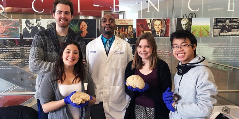 Rastafa Geddes '98 (center) with students at Emory University.
