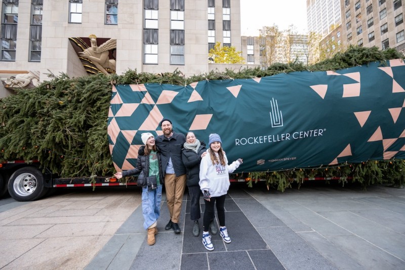 Jackie and Matt McGinley, who donated the tree, pose with their children Zooey and Charlie in front of the wrapped 80-foot tall, 12-ton Norway Spruce from Vestal, NY, that will serve as the 2023 Rockefeller Center Christmas Tree, Saturday, Nov. 11, 2023, in New York.