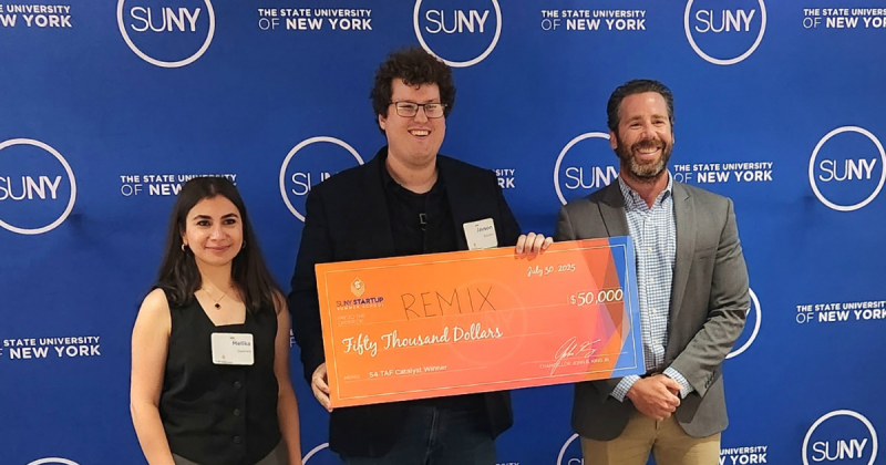 Melika Dastranj, PhD ‘28, and Assistant Professor Jayson Boubin pose for a check for $50,000 with SUNY Research Foundation Director of New Ventures Nicholas Querques.