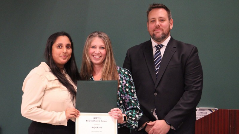 Third-year pharmacy student Sajni Patel accepting her Class of 2027 SOPPS Bearcat Award from Student Success Advisor Erica Folli and Director of Student Affairs James 