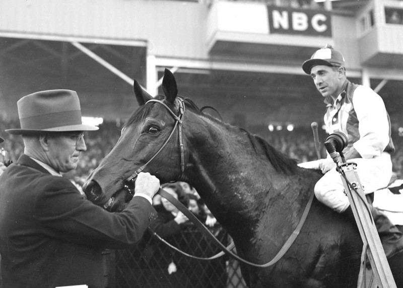 Seabiscuit with jockey George Woolf and trainer Tom Smith after beating War Admiral in 1938 at Pimlico.