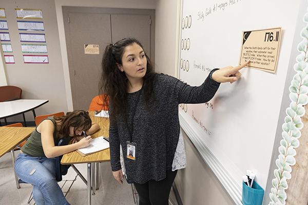 Lexi Pascarella, a student in the College of Community and Public Affairs, assists students at Jennie F. Snapp Middle School in Endicott as part of the Binghamton University Community Schools (BUCS) program.