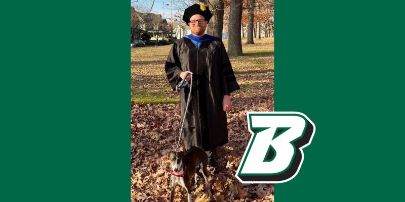 Ryan Stears poses with Pax, an Italian Greyhound who belongs to one of his regular dog-walking clients.