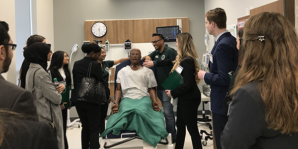 Prospective pharmacy students get a look at the mannequins in the School of Pharmacy Simulation Lab while on a tour led by student ambassadors Raisa Nishat and Tahsin Imam.