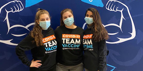 Left to right: Diana Kwiatkowski, Marisa Ferber and Laraib Khan are among several Binghamton University pharmacy students who volunteered to administer the COVID-19 vaccine at MetLife Stadium.