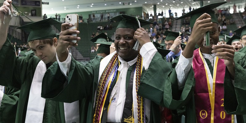 Members of the Thomas J. Watson School of Engineering and Applied Science move their tassels from right to left after receiving their bachelor's degrees at their Commencement held May 22 in the Events Center.