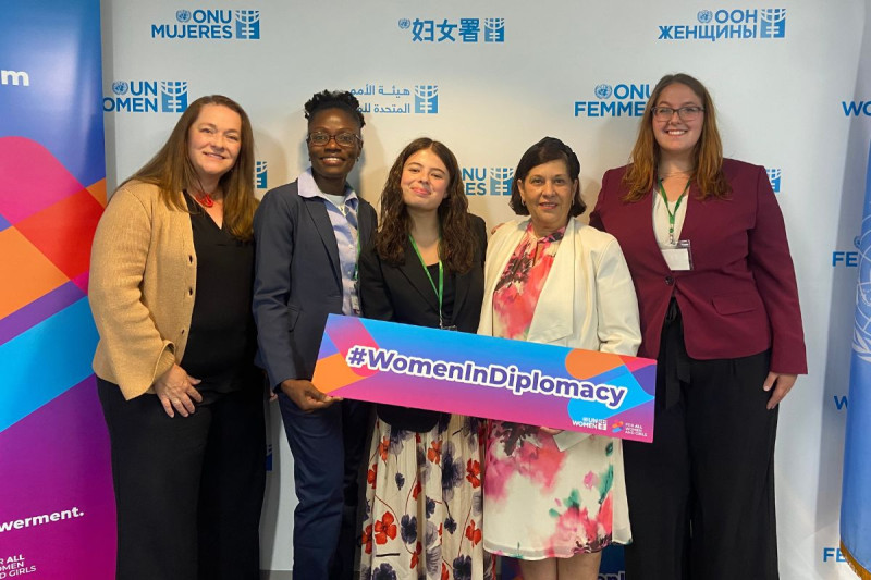 Ammcise Apply (second from the left), Laurie Kern (fifth from the left), and Lauren Wilner (third from the left) at the United Nations (UN) Women Headquarters for the Women In Diplomacy Project.