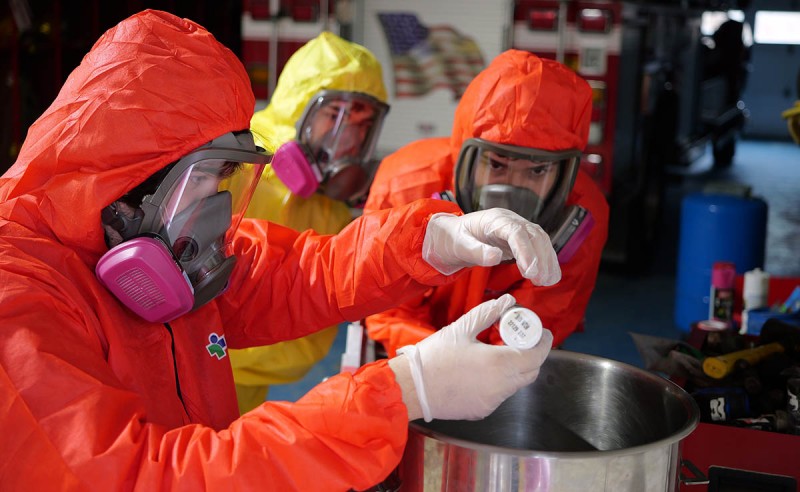 AeroBing team members show extra caution when mixing the propellant needed to launch their rocket.