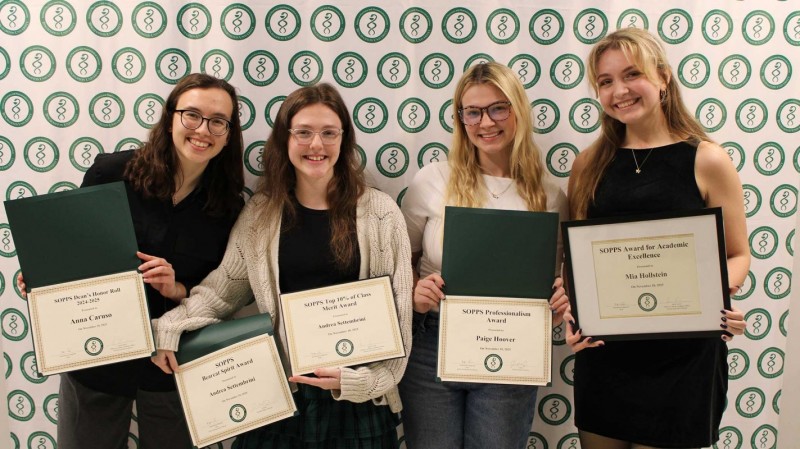 From left to right, pharmacy students Anna Caruso, Andrea Settembrini, Paige Hoover and Mia Hollstein pose together with their awards after the ceremony.