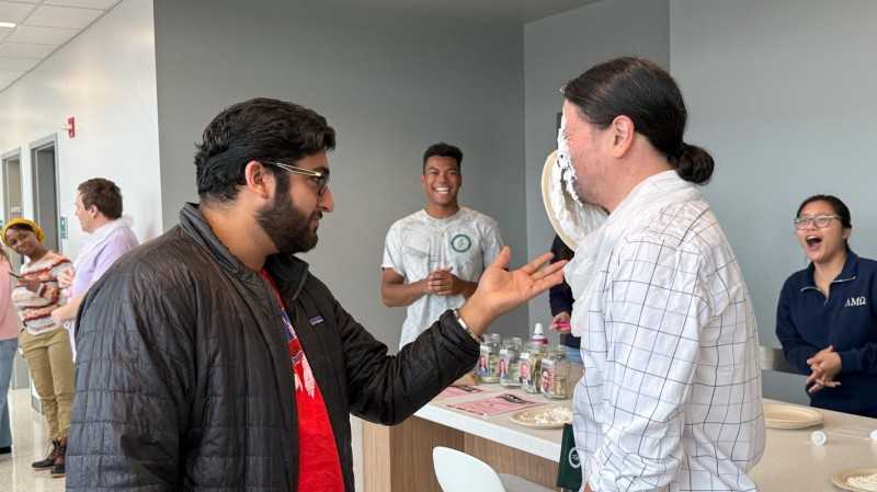Second-year pharmacy student Rohit Kundlas made sure not to miss when it was his turn to pie Clinical Assistant Professor of Pharmacy Practice Anthony Hopkins.