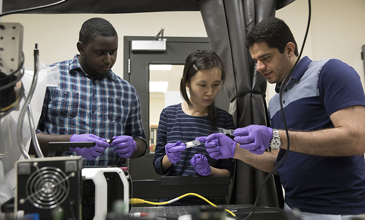 Assistant professor Congrui Jin (center) with two Binghamton University graduate students from the Mechanical Engineering Department.