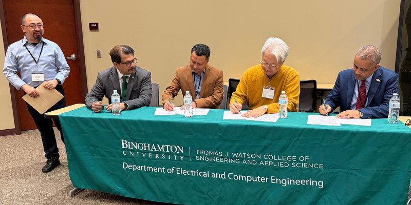 At the signing of the research partnership statement for the Cyber-Physical AI Trust and Integrity (CAITI) research cluster on Thursday were, from left, Watson College Department of Electrical and Computer Engineering Professor Yu Chen; Watson College Dean Atul Kelkar; Professor and ECE Chair Indranil Bhattacharya; Professor Joon Suk Lee, chair of Virginia State University’s Department of Computer Science; and Dean Dawit Haile from VSU’s College of Engineering and Technology.