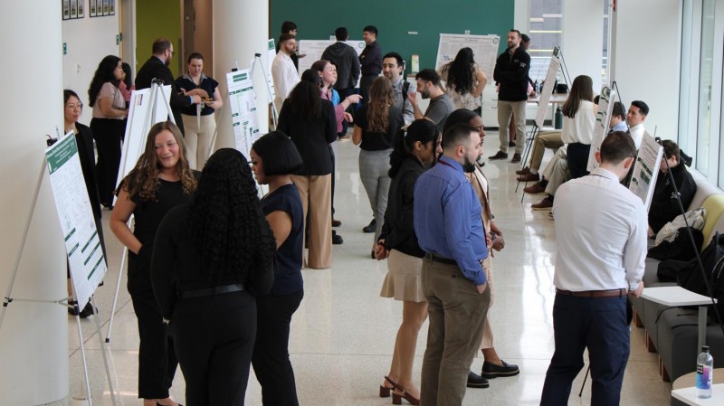 Class of 2025 PharmD students filled the atrium of the School of Pharmacy with their capstone research posters to present their work to their classmates, faculty and staff.