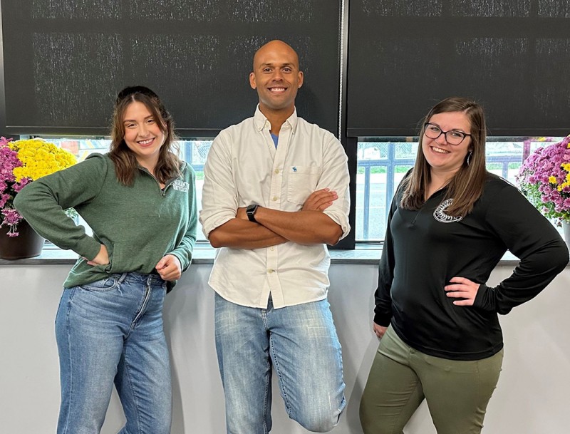 Aly Novi, Aaron Irvine and Carly Miller, all staff within Decker College's Division of Advising and Academic Excellence, show off their casual wear for the division's 