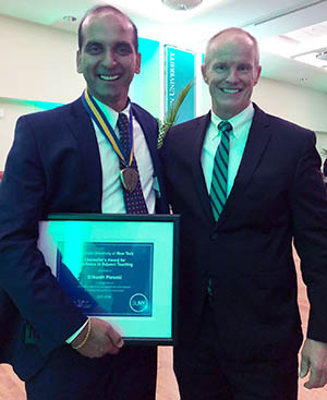 Adjunct Lecturer and Director of Performance Improvements at UHS Srikanth Poranki with Binghamton University President Harvey Stenger.