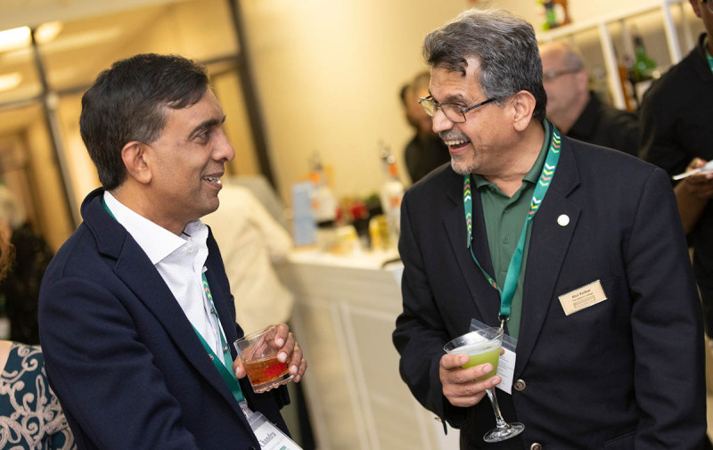 Subhachandra Chandra, MS ’95, chats with Watson College Dean Atul Kelkar at Homecoming 2024.