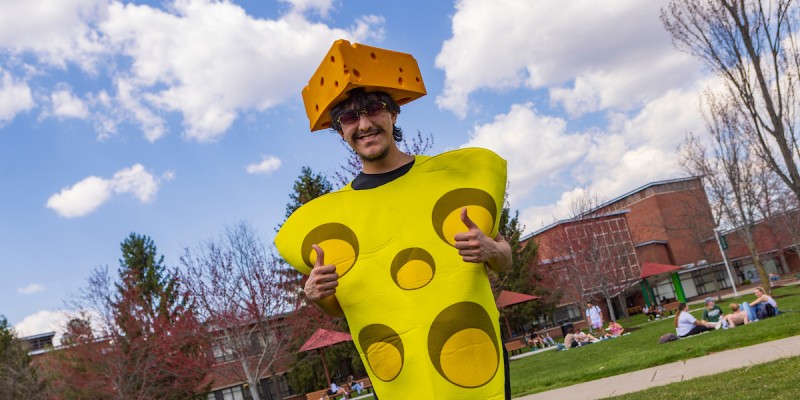 A member of the Student Association Cheese Club at the Peace Quad, April 12, 2023.