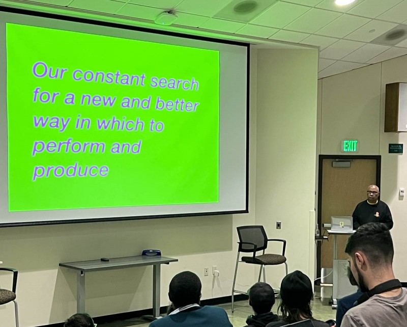 Tony Cokes speaks to Binghamton University students and faculty as the School of the Arts Inaugural Visiting Artist.