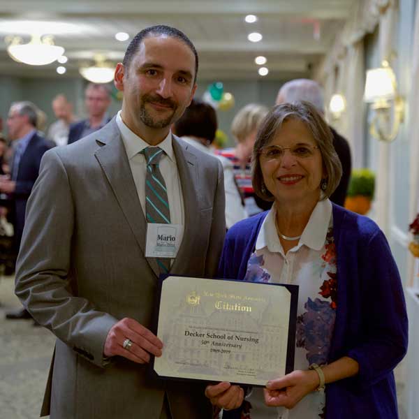 Assemblyperson Donna Lupardo presented Decker College Dean Mario Ortiz with a proclamation to recognize the school's 50 years of excellence and achievement.