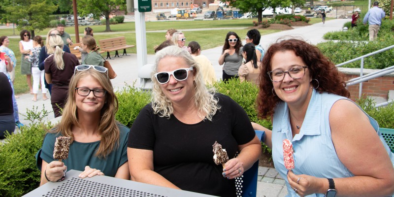 Binghamton University staff and faculty enjoy ice cream treats on the MarketPlace patio, courtesy of the Employee Assistance Program.