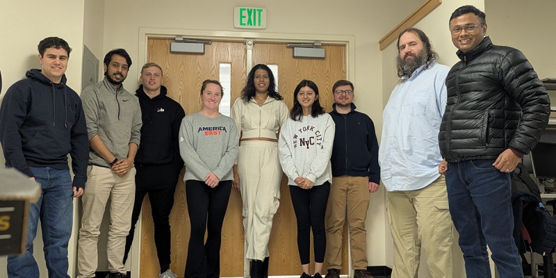 Members of the Embedded Capture the Flag Competition team at Binghamton University for 2025 included, from left, Max Mazer '26; Vivek Raj’23, MS ’25; Liam Murphy '25; Courtney Moane '24, MS '25; Samruddhi Deshpande '26; Aishwarya Mandya Yogananda, MS '26; Ryan Restivo, MS '25; David Demicco ’18, MS ’21, PhD ’25; and Associate Professor Aravind Prakash.