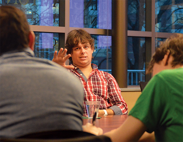 Andrew Eiche '07 speaks with Watson students on campus.
