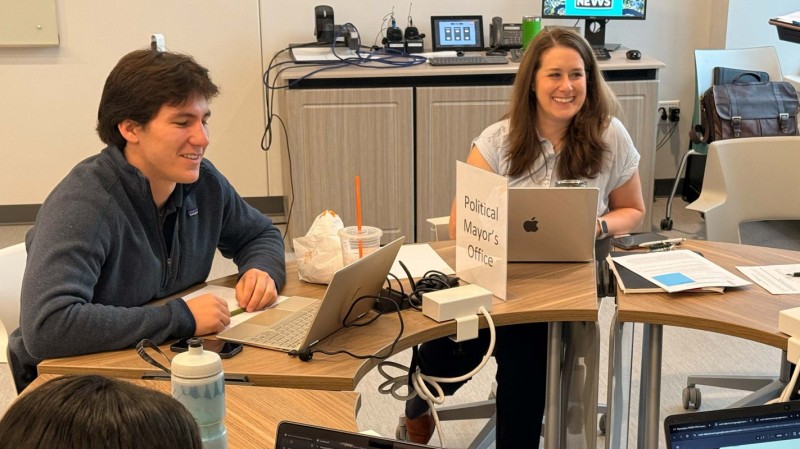 Clinical Associate Professor of Pharmacy Practice Sarah Lynch (right) helped students work in the 