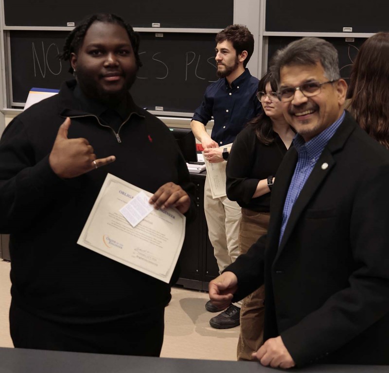 Senior Jamali Hamilton celebrates with Watson College Dean Atul Kelkar during this year's Order of the Engineer ceremony.