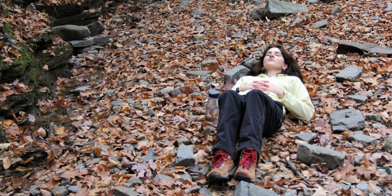 Lilly Moogan, a student in Elias Miller's OUT 177: Hiking course, practices the art of forest bathing.