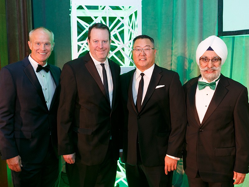 Binghamton University President Harvey Stenger, University Medal recipients David Penski '97 and Charles Kim '98, and School of Management Dean Upinder Dhillon, left to right, at the second SOM fundraising gala.