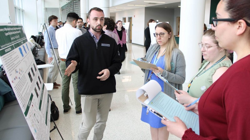 P4 student Joseph Lalla presenting his capstone research project, 