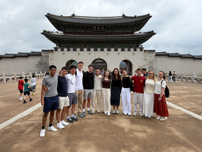 Twelve SOM students pose for a photo during their summer trip to Seoul.