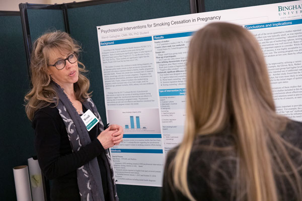 PhD student Wendi Gallagher discusses her research during a poster presentation that was part of the Kresge Center for Nursing Research seminar in March 2019.