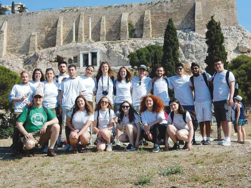 Kent Schull (in green) and his students visit the Acropolis in Greece.