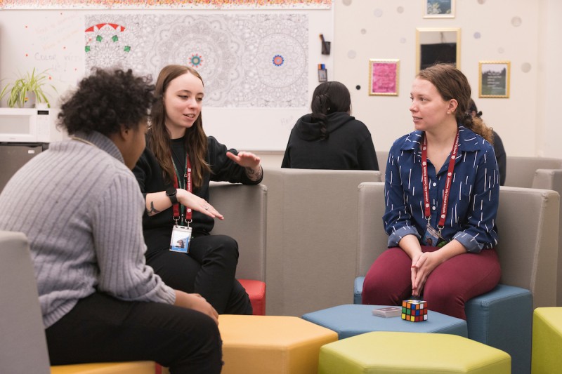 Mackenzie St. John (center) at her Johnson City High School BUCS internship.