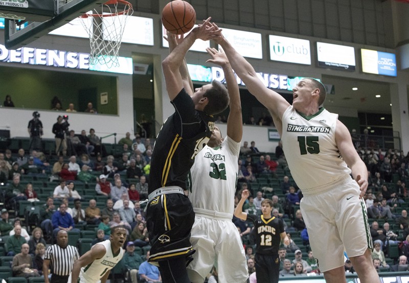 Senior Bobby Ahearn (15) and junior Thomas Bruce (32) anchor the Bearcats' frontcourt.