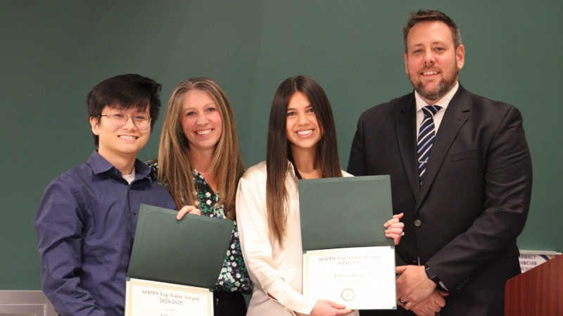 Third-year pharmacy students Felix Aung (left) and Ellinore Hazan (center right) receive their Class of 2027 Top Tutors Award from Student Success Advisor Erica Folli (center left) and Director of Student Affairs James 
