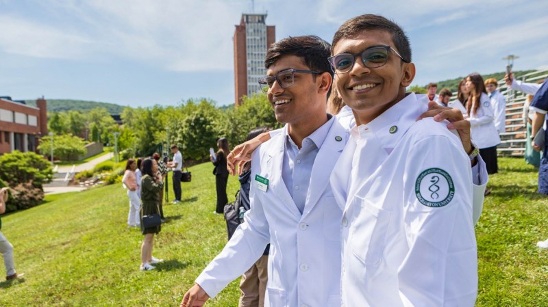 P1 students Dev and Smit Patel are all smiles following the 2025 White Coat Ceremony.