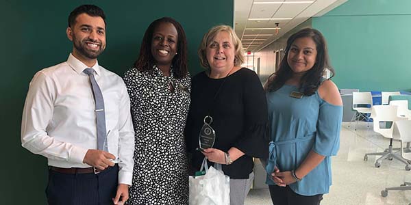 From left, Zeeshan Khalid, pharmacy manager at Wegmans; Angela Riley, executive director of experiential education and assistant dean; Pamela Krolczyk, supervising pharmacist at Wilson Place Pharmacy; and Sara Spencer, coordinator of introductory pharmacy practice experiences.