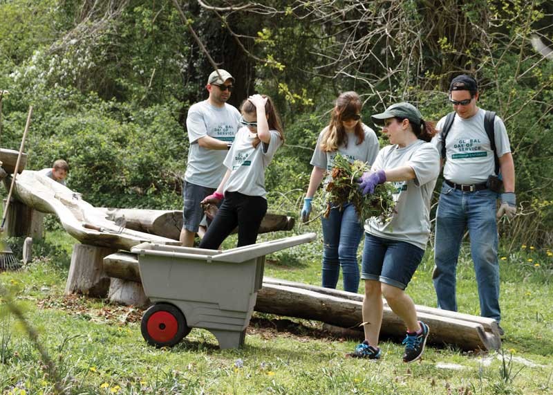 Volunteers prepare gardens at Sweetbriar Nature Center in Smithtown, N.Y.