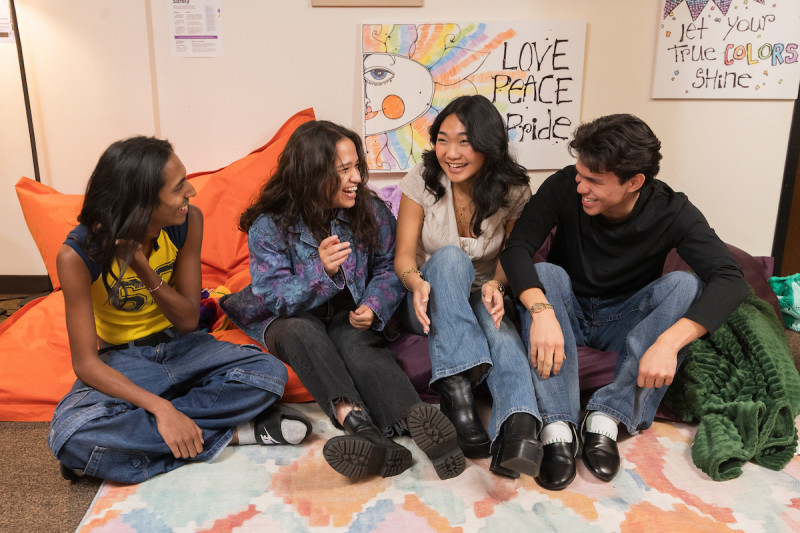 The Q Center is a shared space to hang out, meet up with friends, do homework, and connect with others who share similar lived experiences. The living room space is often used to host social and collaborative events.